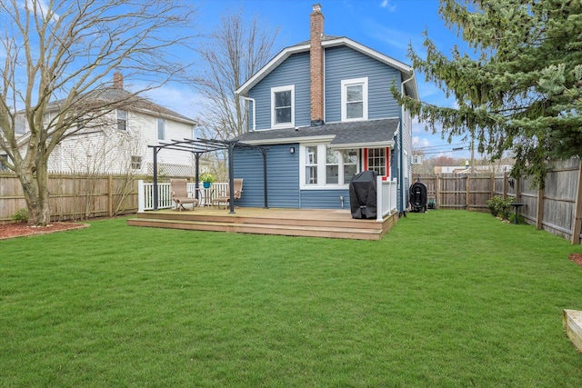 back of property featuring a pergola, a wooden deck, a fenced backyard, and a chimney