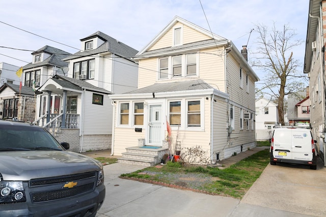 view of front of house featuring a chimney