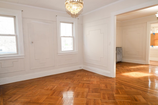 unfurnished room featuring radiator, a chandelier, and plenty of natural light