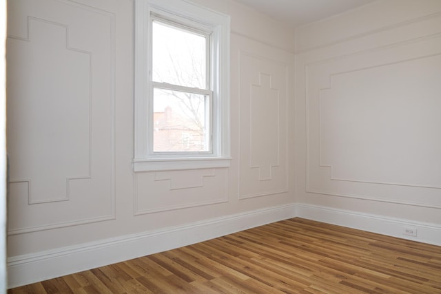 unfurnished room featuring wood finished floors