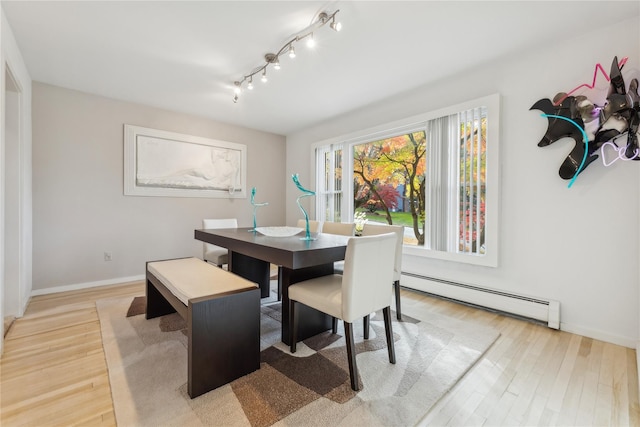 20 Rolling Ridge Rd, New City, NY 10956 - dining space with a baseboard heating unit, light wood-type flooring, baseboards, and track lighting