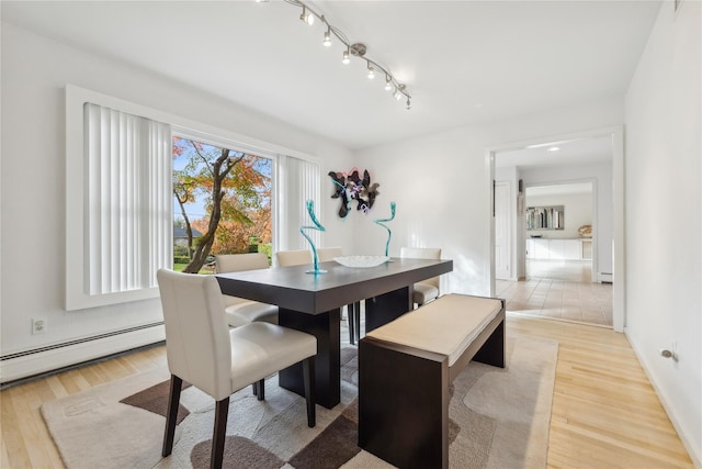 20 Rolling Ridge Rd, New City, NY 10956 - dining space featuring baseboard heating, light wood finished floors, track lighting, and baseboards