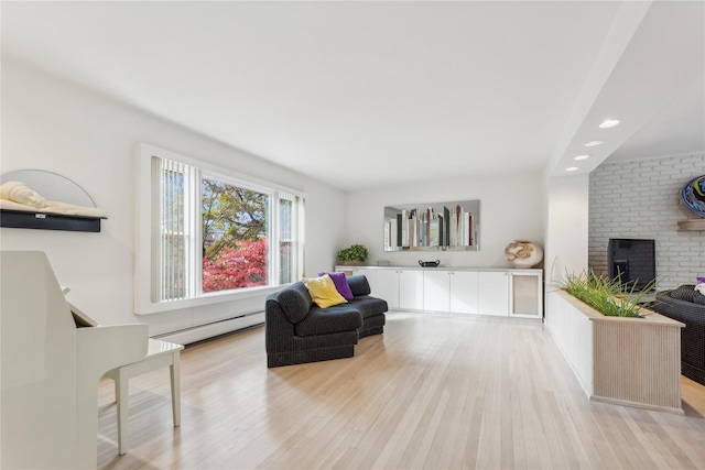 20 Rolling Ridge Rd, New City, NY 10956 - living room featuring a baseboard heating unit, light wood-style floors, a brick fireplace, and recessed lighting