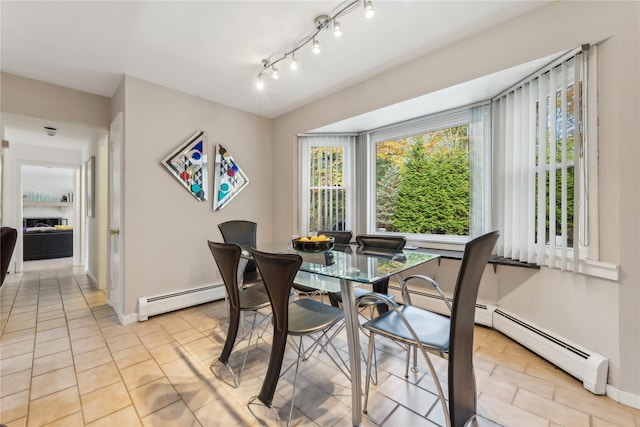 20 Rolling Ridge Rd, New City, NY 10956 - dining room with a baseboard radiator, light tile patterned floors, and baseboards