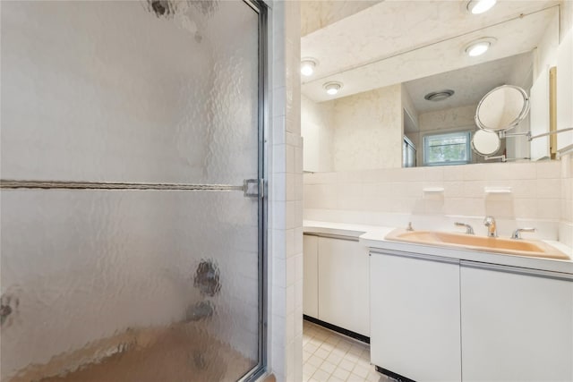 20 Rolling Ridge Rd, New City, NY 10956 - bathroom with a shower stall, vanity, tile walls, and tile patterned floors