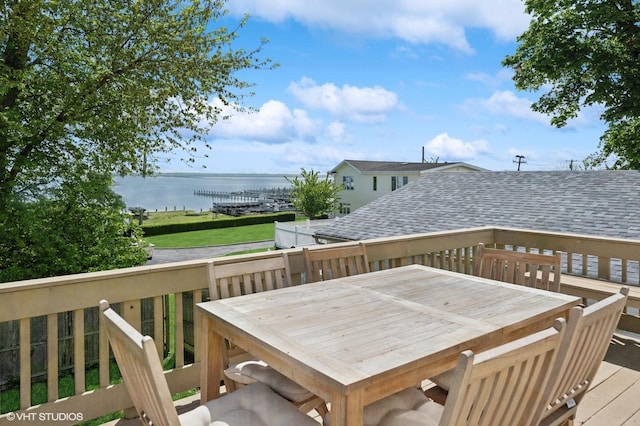 wooden deck featuring a water view and outdoor dining area