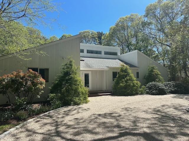 view of front of house with a shingled roof