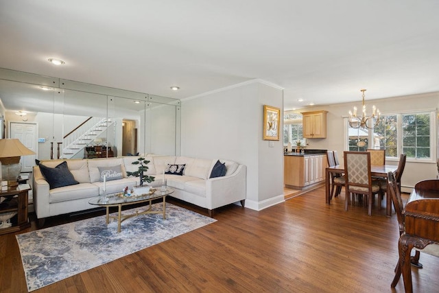 living room with crown molding, baseboards, dark wood-style floors, stairway, and a notable chandelier