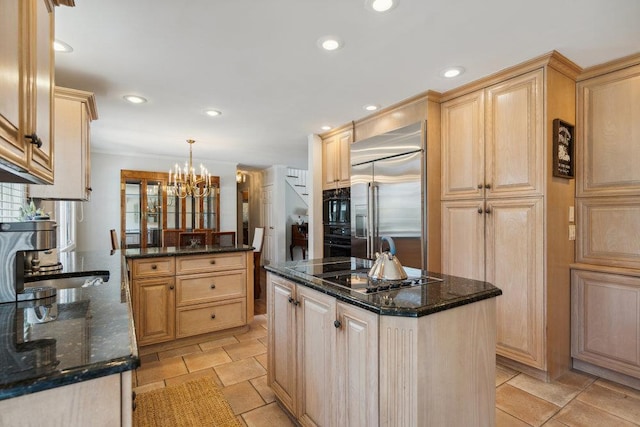 kitchen featuring light brown cabinetry, recessed lighting, a chandelier, and black appliances