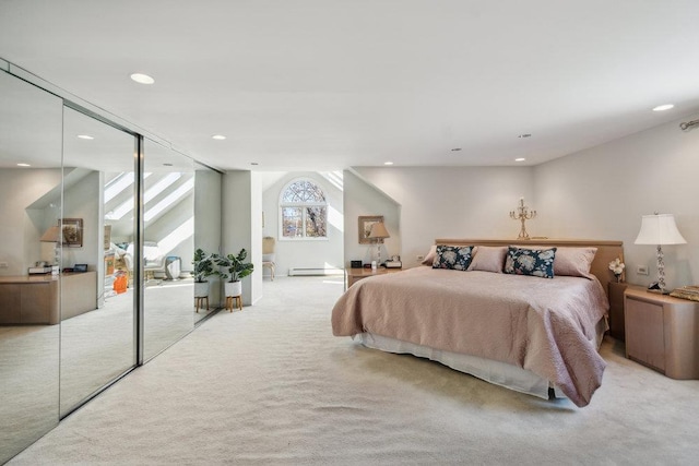 bedroom with recessed lighting, light colored carpet, baseboard heating, and a closet