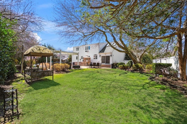 view of yard with fence, a patio, and a gazebo