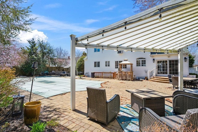 view of patio / terrace with a fenced in pool and outdoor dining space