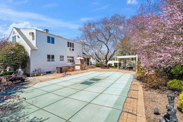 rear view of house with a patio