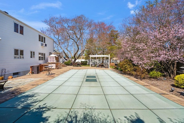 view of swimming pool featuring a pergola and a patio area