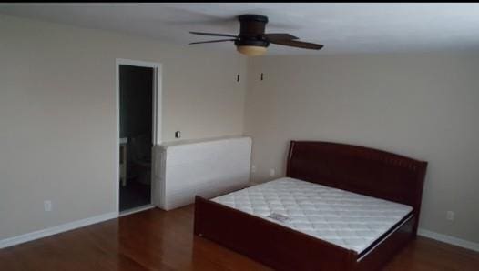 bedroom featuring baseboards, a ceiling fan, and wood finished floors