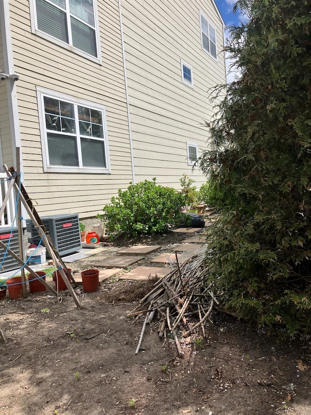 view of property exterior with central AC
