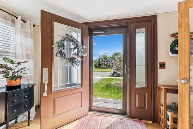 doorway with light wood-type flooring