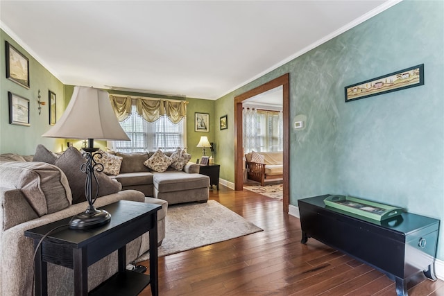 living room with crown molding, baseboards, and dark wood-style flooring