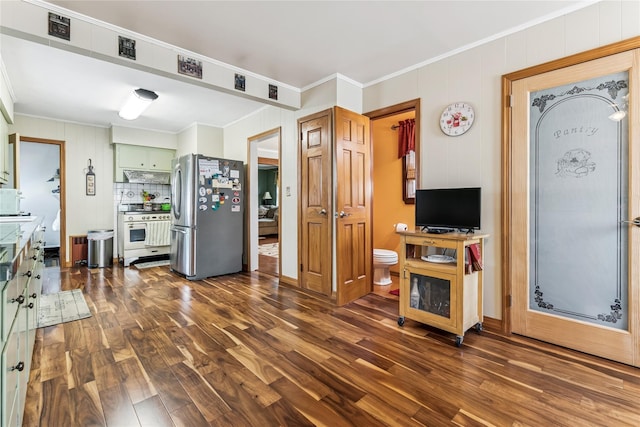 living area featuring dark wood finished floors and ornamental molding