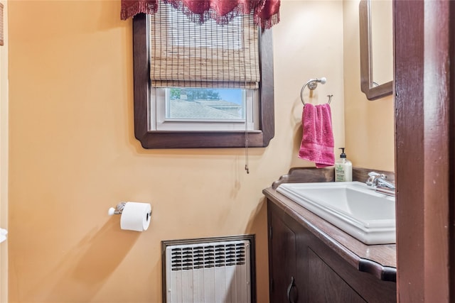 bathroom featuring vanity and radiator heating unit