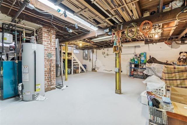 unfinished below grade area featuring stairs, a heating unit, electric panel, and gas water heater