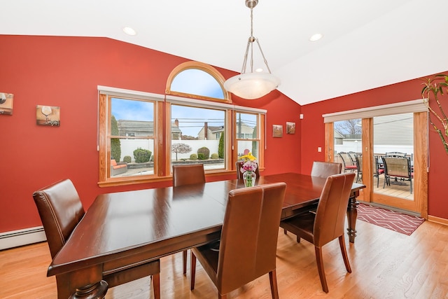 dining area with baseboard heating, vaulted ceiling, recessed lighting, and light wood-style flooring