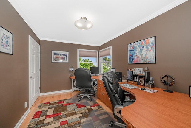 office featuring crown molding, light wood finished floors, and baseboards
