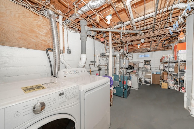washroom with separate washer and dryer, laundry area, and a heating unit
