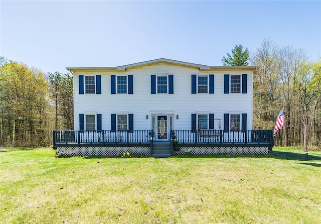 252 Southwoods Dr, Monticello, NY 12701 - colonial inspired home featuring a wooden deck and a front yard