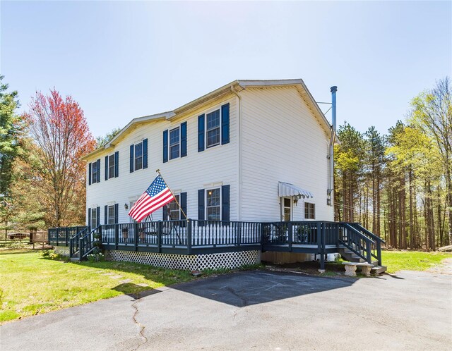 252 Southwoods Dr, Monticello, NY 12701 - view of front of home with a front lawn and a deck