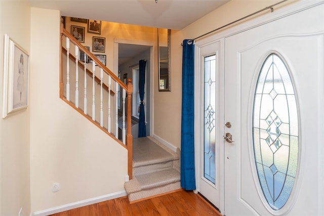 252 Southwoods Dr, Monticello, NY 12701 - entryway featuring stairway, baseboards, and wood finished floors