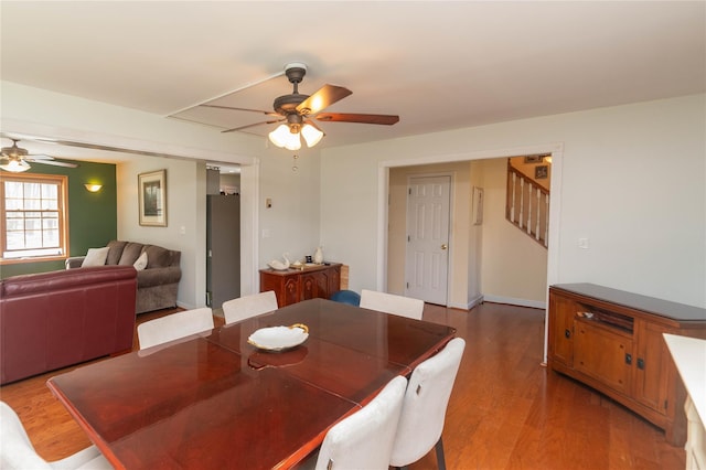 252 Southwoods Dr, Monticello, NY 12701 - dining room with light wood finished floors, ceiling fan, and stairs