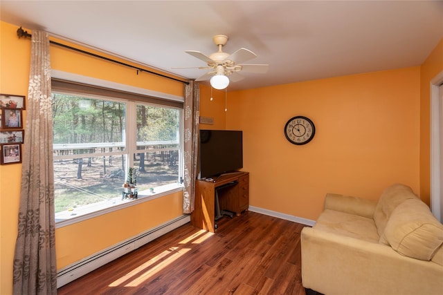 252 Southwoods Dr, Monticello, NY 12701 - living area featuring baseboards, ceiling fan, a baseboard heating unit, and wood finished floors