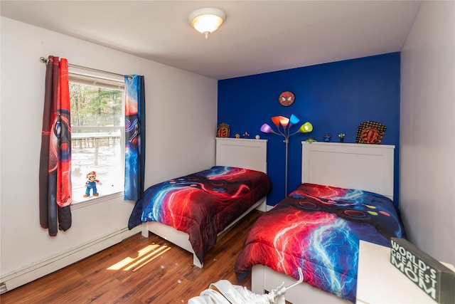 252 Southwoods Dr, Monticello, NY 12701 - bedroom with baseboard heating and wood finished floors