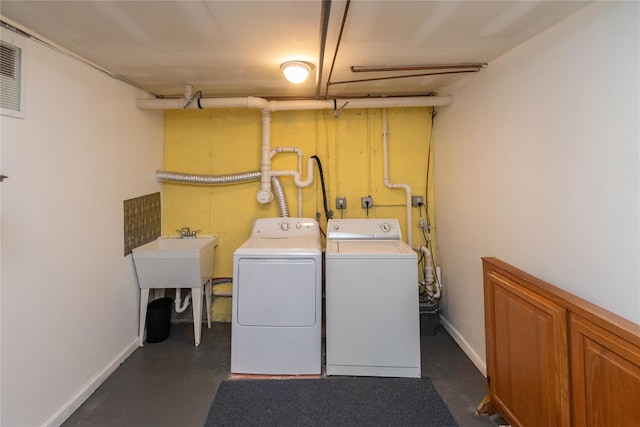 252 Southwoods Dr, Monticello, NY 12701 - clothes washing area featuring separate washer and dryer and baseboards