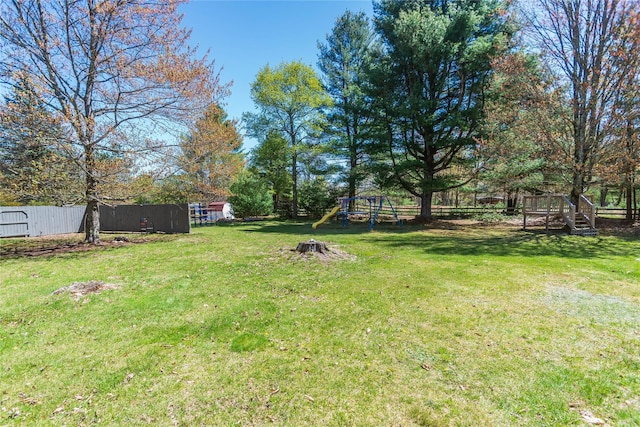 252 Southwoods Dr, Monticello, NY 12701 - view of yard with a fenced backyard and a playground