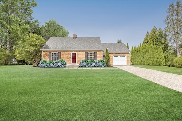 view of front of house with driveway, a chimney, roof with shingles, a front yard, and a garage