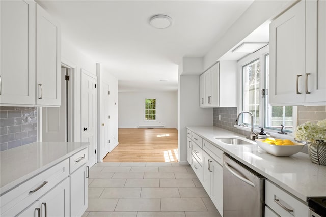 96 Audubon Ave, Bridgehampton, NY 11932 - kitchen with dishwasher, decorative backsplash, light tile patterned flooring, and a sink