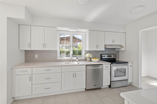 96 Audubon Ave, Bridgehampton, NY 11932 - kitchen featuring under cabinet range hood, a sink, light countertops, tasteful backsplash, and appliances with stainless steel finishes