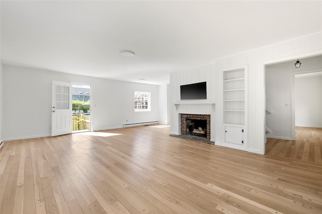 96 Audubon Ave, Bridgehampton, NY 11932 - unfurnished living room featuring baseboards, stairway, light wood-type flooring, and built in shelves