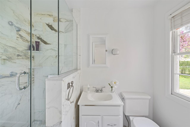 96 Audubon Ave, Bridgehampton, NY 11932 - bathroom with a marble finish shower, vanity, and toilet