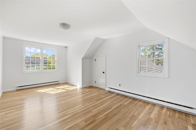 96 Audubon Ave, Bridgehampton, NY 11932 - bonus room featuring a baseboard radiator, light wood-style flooring, lofted ceiling, and a baseboard heating unit