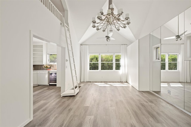 96 Audubon Ave, Bridgehampton, NY 11932 - unfurnished living room with a healthy amount of sunlight and ceiling fan with notable chandelier