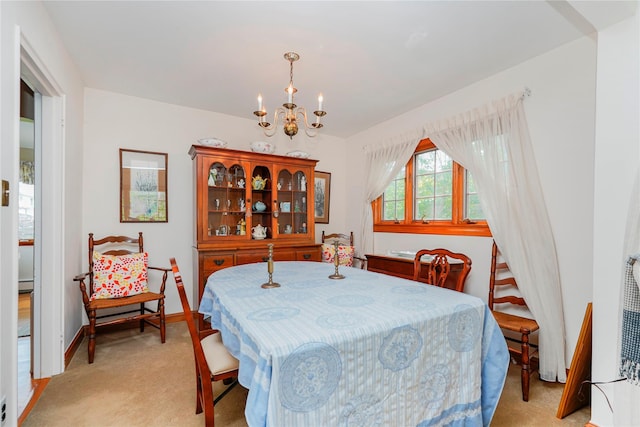 249Slosson Ave, Staten Island, NY 10314 - dining space featuring an inviting chandelier, light carpet, and baseboards