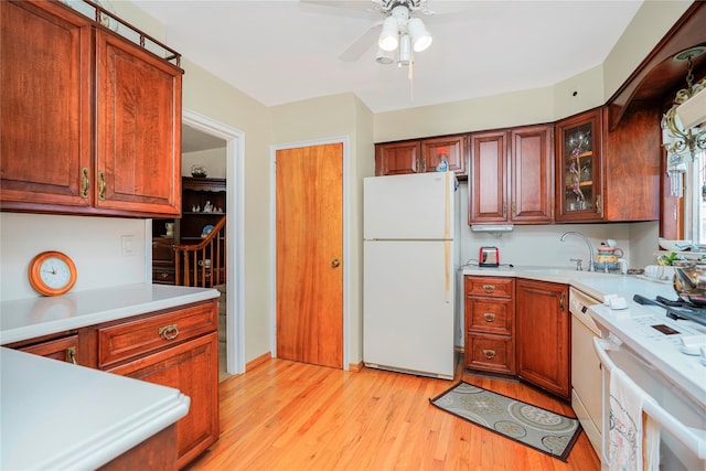 249Slosson Ave, Staten Island, NY 10314 - kitchen with white appliances, light countertops, a sink, and light wood-style floors
