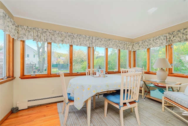 249Slosson Ave, Staten Island, NY 10314 - dining room featuring ornamental molding, baseboard heating, and wood finished floors