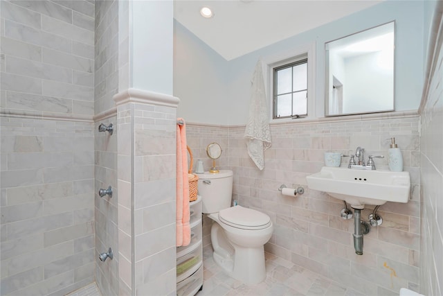 249Slosson Ave, Staten Island, NY 10314 - bathroom featuring toilet, tile walls, tiled shower, and a sink