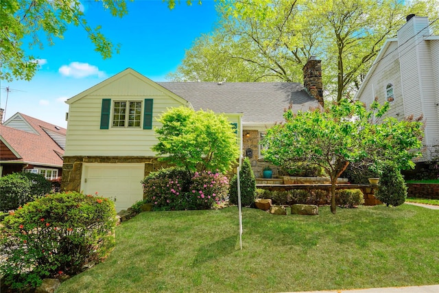 249Slosson Ave, Staten Island, NY 10314 - tri-level home with an attached garage, a chimney, a front yard, and stone siding