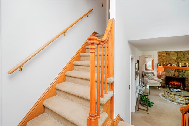 249Slosson Ave, Staten Island, NY 10314 - staircase featuring a stone fireplace and carpet floors