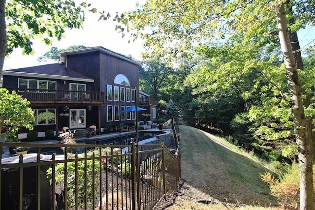 36 Ridgetop Dr, Tomkins Cove, NY 10986 - back of property with a deck, french doors, and an outdoor pool